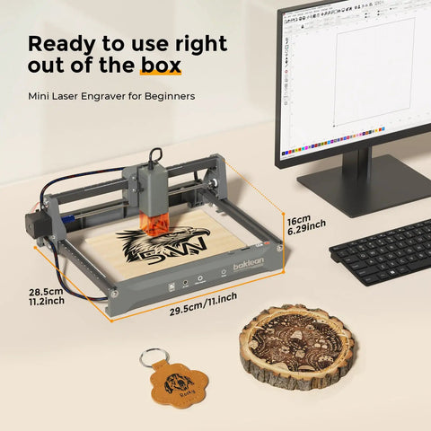10W Desktop Laser Engraver With Full Safety Enclosure, Wireless App Control, And 0.01mm Precision for DIY projects next to computer screen
