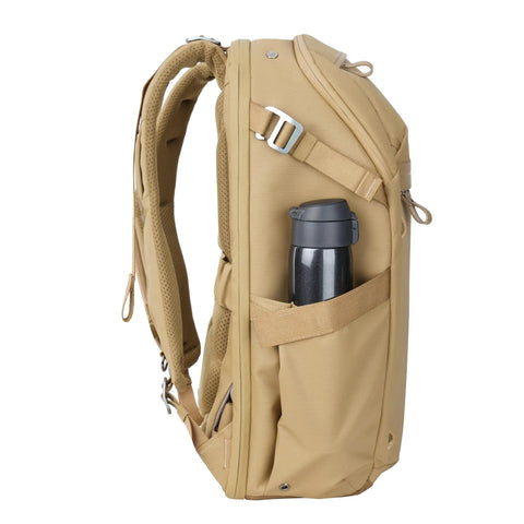 Side view of Metro B30L 30L Camera Backpack With Convertible Daypack In Beige showing pockets and straps, travel ready for creators