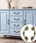 Blue cabinet with 10 Pack Vintage Cabinet Pulls in Antique Brass Finish with 2.5 inch center hole, includes screws