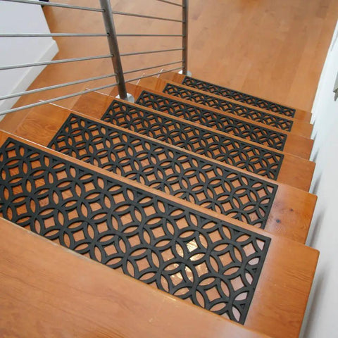 Azteca Indoor Outdoor Rubber Stair Treads 6 Pack Non Slip Mats For Stairs 9.75 By 29.75 Inches Durable Weatherproof Grip And Quick Tape Install For Safer Steps on wooden stairs showing geometric pattern.