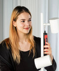 Woman using 4V Cordless Electric Screwdriver Kit With LED Work Light, 6 Torque Settings on lamp assembly