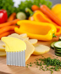 Front view of yellow crinkle cutter with stainless steel ribbed blade for potatoes and vegetables.
