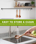 Premium Italian Olive Wood Ladle Kitchen Spoon That Totally Slaps With 12 Inch Long Handle washing under faucet in kitchen.