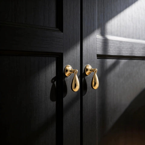 Top Shelf Heavy Duty Solid Brass Cabinet Knob Featuring Slick Brushed Gold Finish on black cabinet doors.