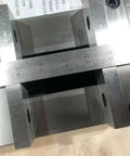 Close-up of Six Inch Double Lock Cnc Machine Vise with Hardened Steel Bed and reversible jaws, showcasing measuring scale and precision.