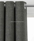 Close-up of dark gray curtains with metallic grommets on a rod, illustrating use for 1.5 Inch Grommet Tool Kit for Curtains and Drapes for DIYers with Setter, Hole Punch Cutter, Block Anvil and 10 Heavy Duty Grommets Ideal for Tents Tarps Textiles and More