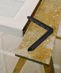 Heavy Duty Stainless Steel Straight Brackets Set Of 4 For Furniture Repair And Reinforcement on a wooden surface.