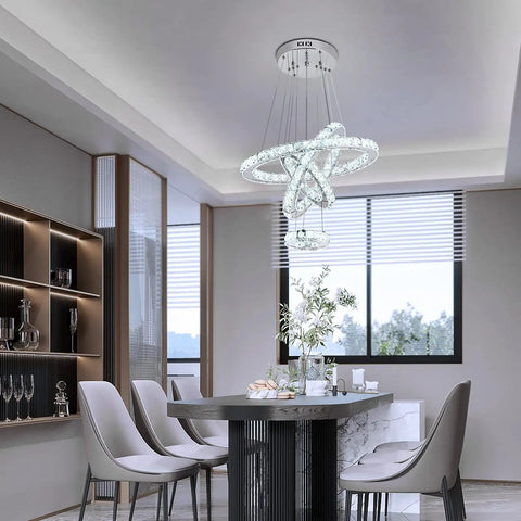 Dope Four Ring Crystal LED Chandelier With Adjustable Pendant Light In Chrome 6000K Cool White Bright Yet Soft Perfect For Living Room Dining Room And Bedroom Luxury Contemporary Ceiling Fixture in modern dining room.