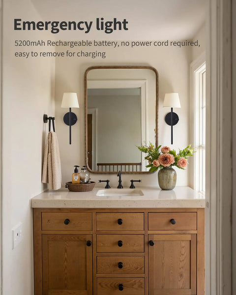 Rechargeable Battery Wall Sconces Set Of Two Black Cordless Lights For Modern Homes No Sweat Install, mounted beside a mirror in a bathroom.