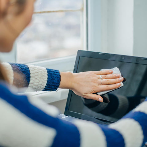 Person using Alcohol Wipes For Electronics With 70 Percent Isopropyl Alcohol, Quick Dry Tech Cleaning Wipes For Computers iPhones And Household Gear