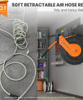 Retractable Air Hose Reel With 50 Foot Three Eighths Inch Hybrid Hose, Heavy Duty Steel Auto Rewind, 300 PSI, Wall Mount, Solid Brass Fittings, Keeps Your Shop Clutter Free And Ready To Roll, installed on a garage wall.
