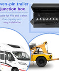 Top Shelf 7 Pin Trailer Junction Box Featuring Plug And Play Wiring With Road Ready Weatherproof Housing For Motorhome Camping Lighting Systems and Heavy Duty Automotive Fixes, black housing and 7 connectors.
