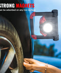 2Pack Rechargeable LED Work Light With Magnetic Bases used for tire repair, showing strong magnet holding to wheel