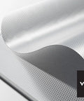 Close-up of Tesla Model Y Roof Sunshade Full Blackout With Graphene Enhanced UV Coating And Silver Reflective Layer, dual-layer fabric in gray.