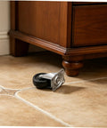 Four Pack Two Inch Rubber Swivel Caster Wheels Dead Silent Low Profile Design on tile floor under wooden furniture.