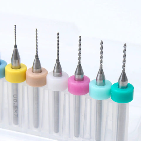 Close-up of micro twist bits from Pro Grade 61 Piece Pin Vise Drill Set with colorful holders for jewelry making and crafts.