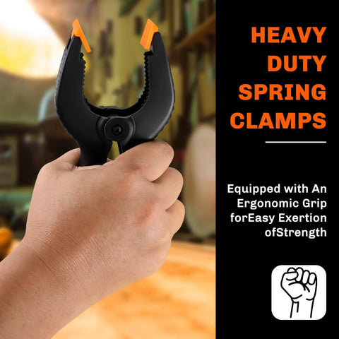 Hand holding a heavy duty spring clamp with ergonomic grip; ten pack heavy duty spring clamps set with three sizes 6.5 inch 4.5 inch and 3.5 inch plastic backdrop clips for crafts woodworking photography and DIY projects.