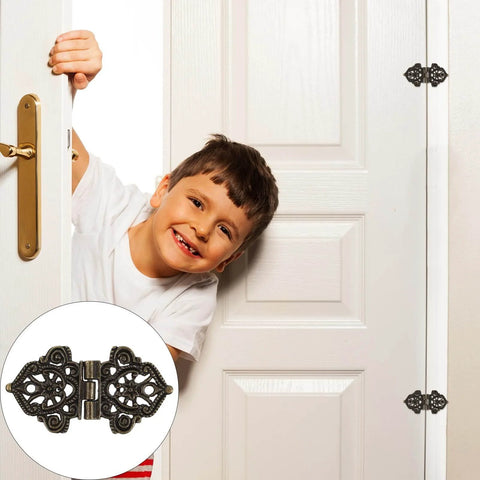 Butterfly Hinges 10 Pack Zinc Alloy for Wooden Boxes and Small Cabinets shown on a door with a decorative design.
