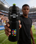 Man holding a FIFA World Cup branded black water bottle at a stadium