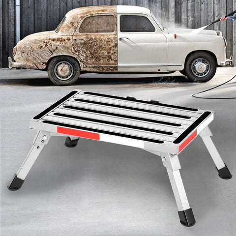 Beefy Heavy Duty Aluminum RV Steps Folding Platform Stool with rubber feet and reflective strips by a vintage car