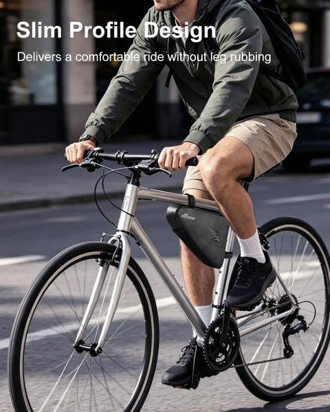 Cyclist using Bike Tire Repair Kit For Flat Tires With Portable Pump 120 PSI, 16-in-1 Multitool, Triangle Frame Bag attached.