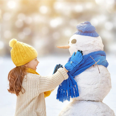 Child building snowman wearing Kids Ski Gloves Cool Warm Winter Thermal Fleece Snow Gear For Skiing And Snowboarding Water Repellent
