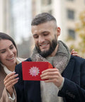 Couple holding a greeting card made with 8 Pattern Round Lace Border Die Set For Card Making And Paper Crafting With Dope Floral Motifs