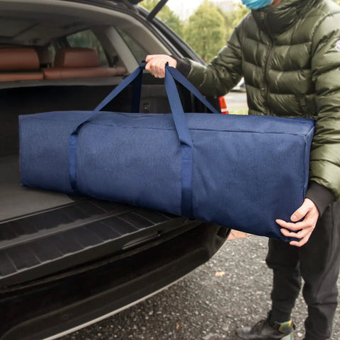 Person loading Massive 46 Inch Extra Large Zippered Duffel Bag For Travel Camping And Sports Gear Storage Waterproof