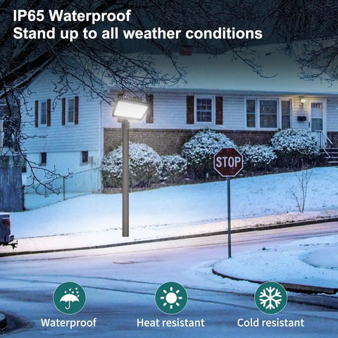 Ultra Bright LED Flood Light With Dusk To Dawn Photocell, 150W Adjustable illuminating a snowy residential street