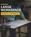 Person using Heavy Duty Steel Welding Table With 24-Piece Fit-Up Tool Kit, 600 Lb Capacity, 36 In L X 24 In W X 33 1/4 In H, 16 mm holes