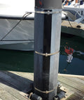 Five Eighths Inch Wide 304 Stainless Steel Band used on a marine dock piling for heavy duty support and durability.