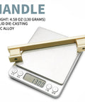 Brushed satin brass cabinet handle on scale, weight 4.58 oz, solid zinc alloy, 10 Pack 5 Inch Brushed Satin Brass Cabinet Handles For Dresser Drawers And Kitchen Cabinets With 5 Inch Hole Center Built From Solid Zinc Alloy For Rugged Durability And Corrosion Resistant Finish Perfect For Modern Furniture And Cabinets.