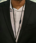 Close-up of a black breakaway clasp from 50 Pack Breakaway Clasps for Necklaces and Jewelry Making, on a man's lanyard.