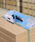 Knuckle Down To Packing With This Darn Reliable 3 In 1 Electric Strapping Machine featuring PP PET band on wooden boards.
