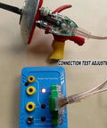 Fencing Gear Diagnostic Tool with color-coded slots and indicator lights testing an epee blade for maintenance.