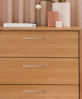 Wooden dresser with beech wood door pulls and drawer handles, showcasing 96mm lacquer finish, perfect for cabinets and DIY makeovers.