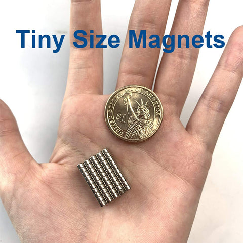 Hand holding Tiny 3x2mm Magnets Set with coin for scale for 3D printing crafts miniatures and small models great for connecting figure joints