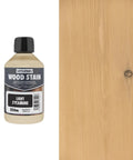 Kickass Water Based Wood Stain For Indoor Furniture And Daily Woodworking Eco Friendly Non Toxic Formula In Light Sycamore 8.5 Oz bottle next to light sycamore wood
