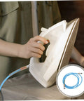 Person using an iron with Workhorse High Pressure Steam Tube Replacement Flexible Steam Iron Cleaner Hose With PTFE Material