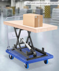 Heavy Duty Dc 24v Electric Scissor Lift Table With 250lbs Load Capacity Plus Handy Remote Control For Smooth Hydraulic Material Handling And Sturdy Workstation Support with a box on top.