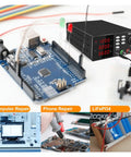 Programmable USB Adjustable DC Laboratory Power Supply With Switching Regulation 0 To 60V Output And 0 To 10A Capacity on desk with PCB components