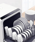 Hassle Free Portable Countertop Dishwasher With A Slick Compact Build Dead Simple To Run And Delivers High Efficiency Cleaning For Sparkling Dishes Daily, filled with clean white dishes and utensils.