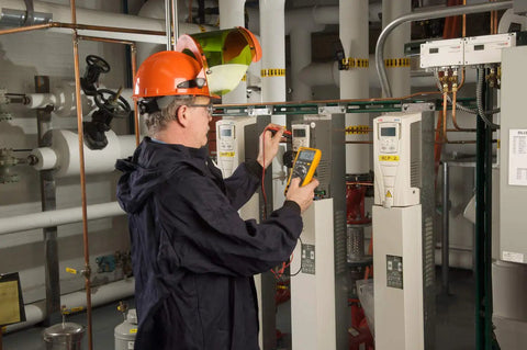 Technician using Industrial Electronics Multimeter Combo Kit With Probes And Hooks Six Piece DMM Set For Troubleshooting.