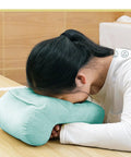 Person using Donut Desk Nap Pillow Cushion With Velvet Fabric, Soft Donut Shaped Pillow For Face Down Sleepers, Hollow Design For Neck Support