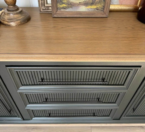 Close-up of cabinet with Black Zinc Alloy Cabinet Handles Set of 6, 12.6 Inch Center To Center Pulls, on ribbed drawer front.