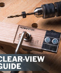 Pro Grade Quarter Inch Doweling Jig Kit With Laser Alignment Marker showing depth scale and attached drill on workbench.