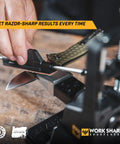 Pro Grade Precision Adjustable Knife Sharpener With 7 Abrasives Including Diamond And Ceramic Leather Strop Beefed Up 15 To 30 Degree Angles Built For Hunting Serrated And Kitchen Knives sharpening a blade on a wooden table.
