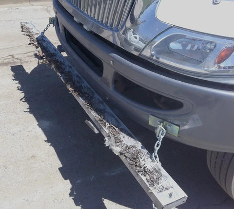 Rig Ready Magnetic Road Sweeper That Knocks Nails And Scrap Metal Out Of The Way On Job Sites with mounted bracket on truck.