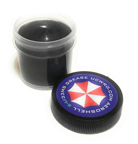 Open Pro Grade AeroShell 33MS And 64 Grease 1 Oz container showing dark lubricant for hinges, gears, and bearings.