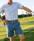 Man wearing Braided Stretch Belt For Men And Women No Hole Adjustable Multicolored Woven Belt Elastic Golf Style Jean Belt on golf course